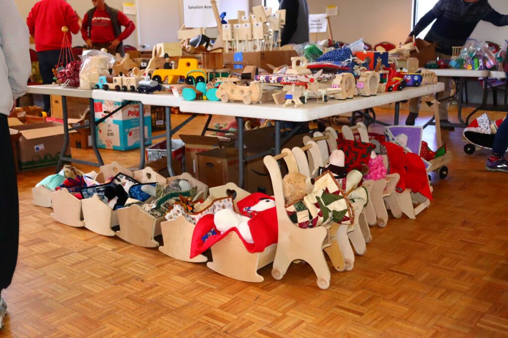 The tables are being loaded up with toys, quilts and bears
